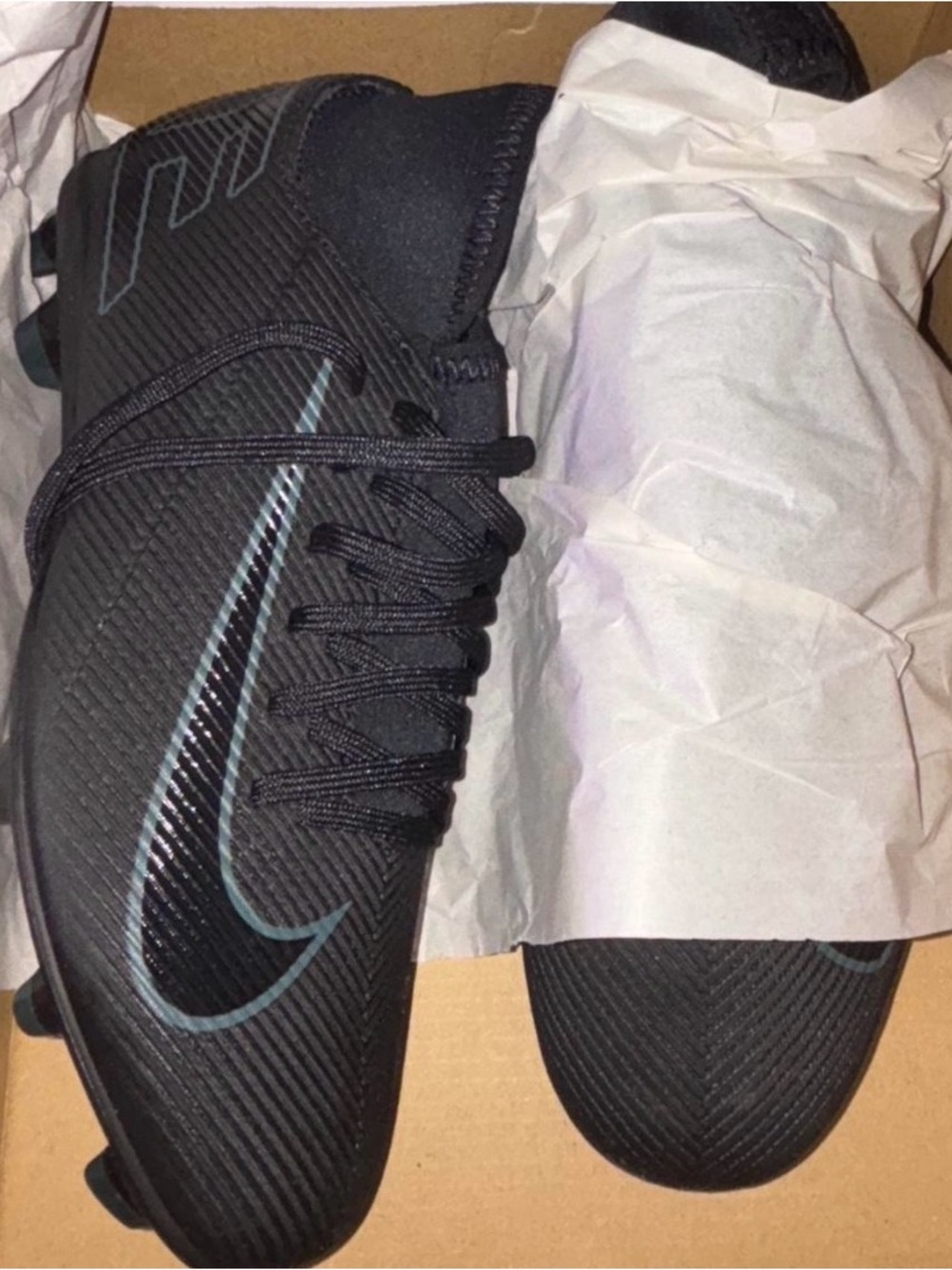 Nike Black Athletic Cleats with Teal Accent